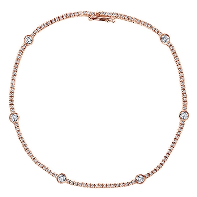 1.25 carats of diamonds are set in rose gold for a simple and beautiful look, with six bezel set diamonds to draw attention.