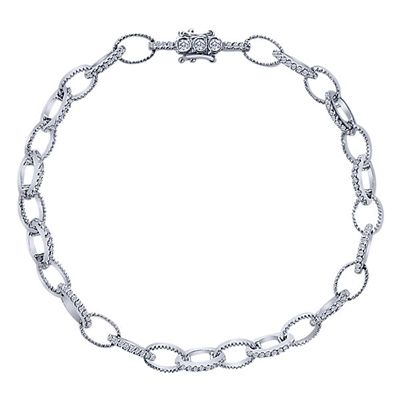 Alternating diamond links connect in this 14k white gold diamond tennis bracelet.