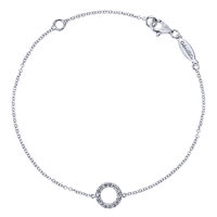 A singular diamond circle sits in the center of this 14k white gold diamond bracelet.