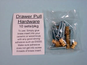 A set of Drawer Pull hardware on a blue-grey background. The hardware consists of silver screws and brass anchors together in a plastic pack. To the left of them is a sheet reading Drawer Pull Hardware, 10 sets/pkg, and instructions on their use.