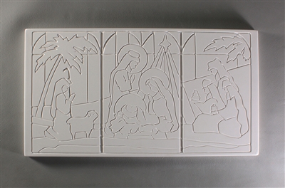 A long rectangular tile made of white ceramic. The carved texture is divided into three parts of a nativity scene done in a simple stained glass style. The left has the shepherd and sheep, the center the holy family and star, and the right the wise men.