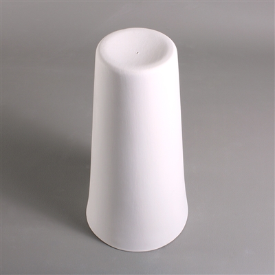 A tall white ceramic mold for fusing glass on a grey background. It is cylindrical, but tapers slightly at the top.