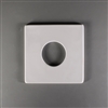A square white ceramic mold for fusing glass on a grey background. A small circle has been cut out of the center, leaving a relatively flat square with a small circular hole in the middle.