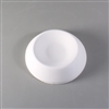 A circular white ceramic mold for fusing glass on a grey background. The outer edges begin to raise towards the middle like a dome, but the top has instead been turned into a large circular depression with a flat center.