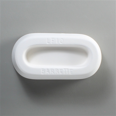 An oval, white ceramic mold for fusing hot glass on a grey background. A long oval with flat sides has been carved into it. The mold has LF10 Barrette engraved on the sides in print.