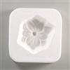 A square, white ceramic mold for fusing hot glass on a grey background. A simple flat magnolia flower with a deep center has been carved into it. The mold has Little Fritters #11 Magnolia engraved on the sides in script.