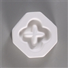 An octagonal, white ceramic mold for fusing hot glass on a grey background. A simple geometric representation of a four-leaf clover has been carved into it. The inside of the clover is not carved in, so the finished project has an open center.