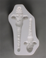 A rectangular white ceramic mold for fusing hot glass on a grey background. Two separate snowmen in knit hats and scarves with elongated icicle bodies have been carved into it. There is a post in each hat allowing for hanging after firing.