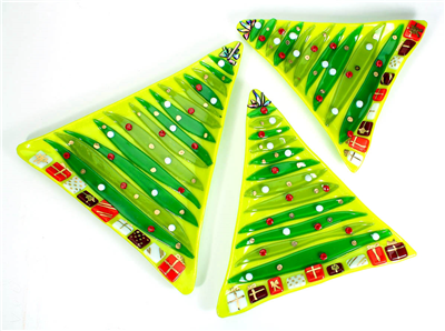 Three triangular green glass dishes in slightly varying sizes made to look like Christmas trees. They are all similarly decorated with thin lines of other shades of green stacked upwards towards the points. Each has small circular ornaments and presents.