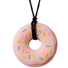 Got Special KIDS|The Munchables Donut Chew Necklace is our firmest design. It features a slightly textured front side that has raised sprinkles on it and a smooth reverse side.