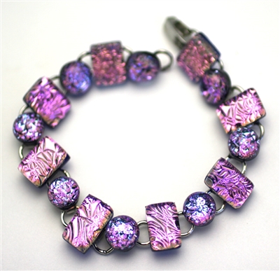 Pink and purple sparkle glass bracelet handmade on Maui.   16 buttons and rectangular shapes.