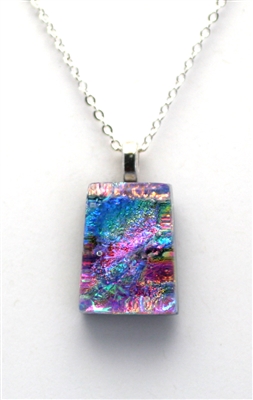 Dichroic glass pendant. Ocean sparkle with rainbow on black glass. Handmade on Maui