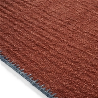 Elitis Atacama Terracotta.  100% linen maroon textured area rug.  Click for details and checkout >>