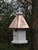 Our Cottage Bird House is lovely hanging from a tree. The copper roof adds to the beauty. Will patina over time