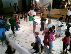 photo of kids playing with fake snow