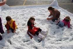 photo of kids playing with fake snow