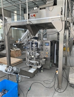 USED BAGGING MACHINE INCLUDING PRODUCT WEIGHING SYSTEM