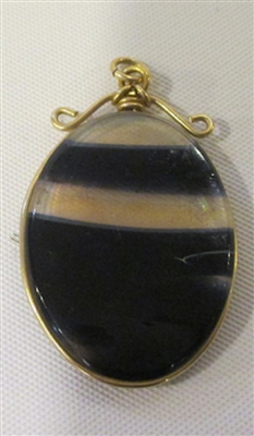 David Lotton Art Glass Pendant
Group was made by David in 1985 Signed or Initialed by David
Glass cut and polished and wrapped in gold wire.
Each Pendant is One of a Kind.
Size   1 by .5