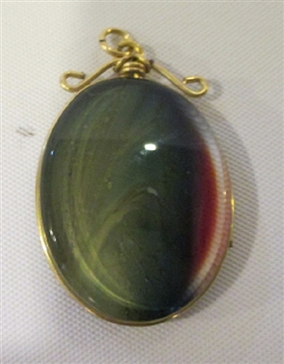 David Lotton Art Glass Pendant
Group was made by David in 1985 Signed or Initialed by David
Glass cut and polished and wrapped in gold wire.
Each Pendant is One of a Kind.
Size   1 by .5