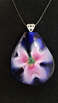 Kim Lotton Art Glass Pendant
Glass was hand blown by Robert  Lagestee
Pendant cut and polished with silver catch added by
Kim Lotton. signed KL
Each Pendant is One of a Kind.
Each is shipped with a leather neck band.
Size of glass 3  by 2.5
