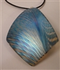 Kim Lotton Art Glass Pendant
Glass was hand blown by David Lotton
Pendant cut and polished with silver catch added by
Kim Lotton.  signed KL
Each Pendant is One of a Kind.
Each is shipped with a leather neck band.
Size of glass 3 by2.25