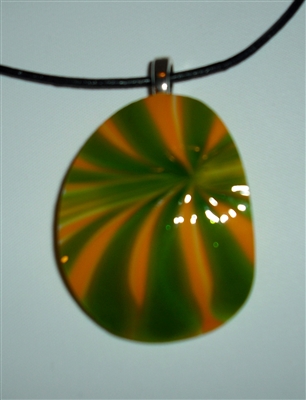 Kim Lotton Art Glass Pendant Nu 108
Glass blown by David Lotton
Colors in Orange Yellow and Green
Leather Cord
Size 2 by 1.5
Signed KL for Kim Lotton
Not Dated