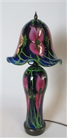 Daniel Lotton Lamp
Blue with Pink Iris Base and Shade.
Green Leaf and Vine.
Lights both base and shade
Lighter pic is the lighted lamp
Really Beautiful Medium Sized Lamp
Size 25  by 10
Signed Daniel Lotton   Dated  2014