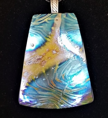 Kim Lotton Art Glass Pendant
Glass was hand blown by David Lotton
Pendant cut and polished with silver catch added by
Kim Lotton.
Each Pendant is One of a Kind.
Each is shipped with a leather neck band.
Size of glass 2.5 by 2
