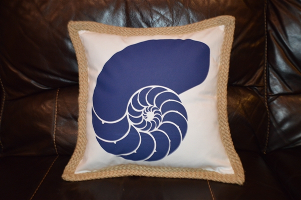 Blue nautilus shell on white pillow