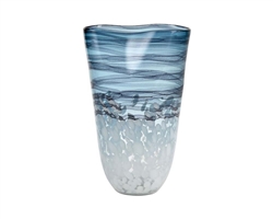 Loch Seaforth Vase Large is made from glass and features a translucent blue and white finish. Ideal for coastal or natural inspired arrangements, its watery, swirling design is furthered by its gently curving rim.