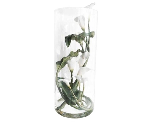 This beautiful floral arrangement features a clear glass base with white Callas Lilies on a vine carefully crafted to look seemingly real.