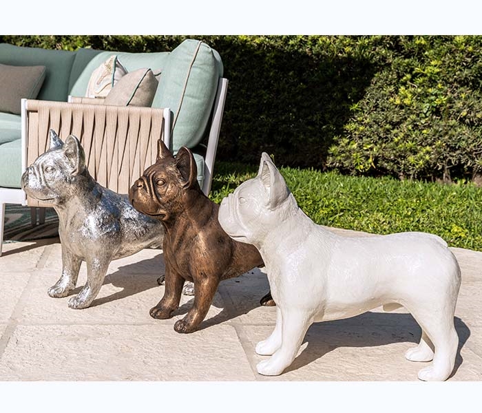 French Bulldog sculpture collection in bronze, silver, and white finishes adding whimsy to modern decor.