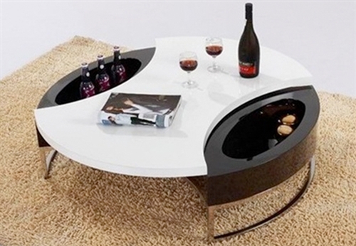 This modern round coffee table finished in white and black lacquer or white and walnut wood provides great looks and ample storage.