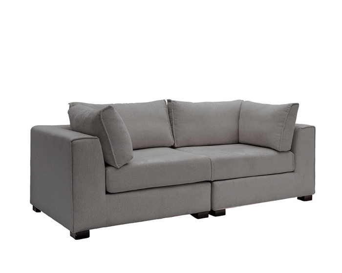 Vittoria sectional sofa in a modern living space, showcasing single armchair, armless chair, and ottoman configurations.