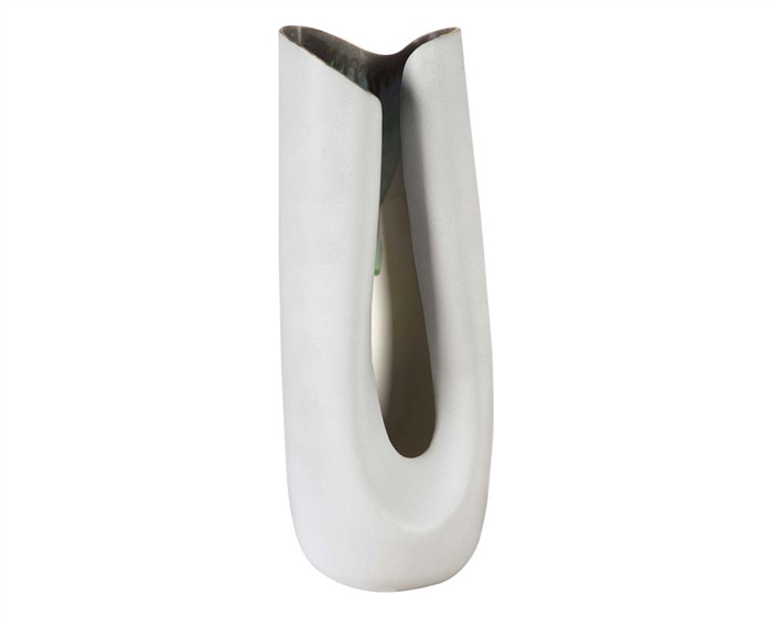 Indigo Vase Tall Created in a high fired white reactive glaze porcelain with an indigo and deep teal edge, this sculptural and useful vase is crafted and decorated individually by artisans guaranteeing that every piece is a unique statement.