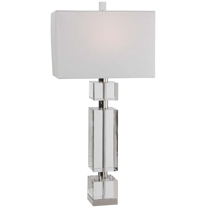 Maika Modern Table Lamp.This table lamp has a fresh, contemporary look featuring thick crystal blocks separated by polished nickel plated accents. The rectangle hardback shade is a white linen fabric.