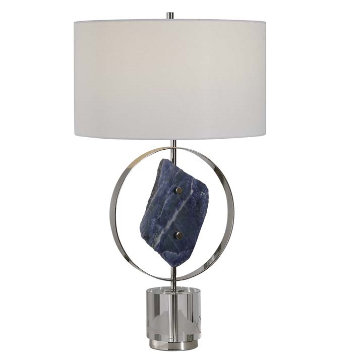 Xena Modern Table Lamp. This table lamp features a large lapis stone, which has been mined from Central Asia via the Indus Valley for thousands of years and has become highly valued for its rich blue color. The base of this piece showcases a thick crystal