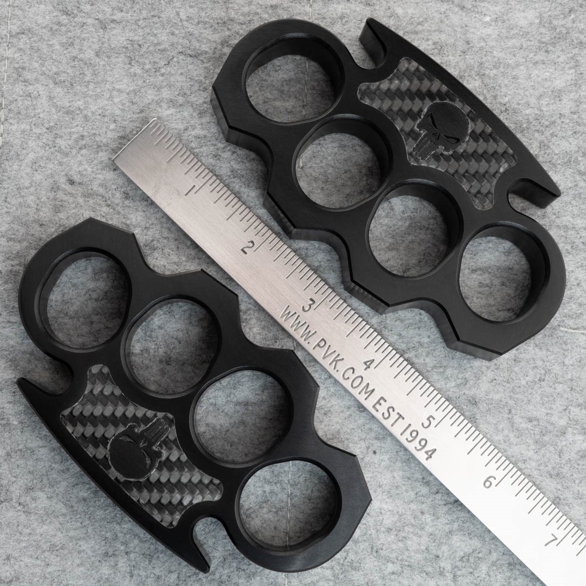 Brass knuckles on black stone background, closeup Stock Photo