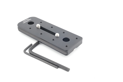 4.00 inch Arca-Swiss compatible double-dovetail lens plate featuring two QD sockets machined directly into the plate body. Ridge is optional and not included.