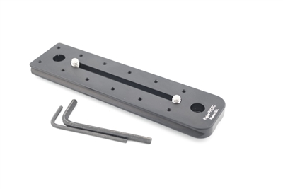 6.00 inch Arca-Swiss compatible double-dovetail lens plate featuring two QD sockets machined directly into the plate body. Ridge is optional and not included.