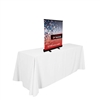 24in Tabletop Economy Retractor No Curl Banner Kit, Black - One of our lightest weight retractors. Retractable table top banners are the perfect marketing solutions for trade show booths. Tradeshow Table Top Banner Stands are portable and easily set up