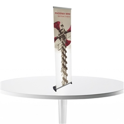 16in x 63in Phoenix Mini Full Height Retractable Tabletop Banner Stand with Vinyl Banner - a small tabletop-sized version of larger roll-up signs. View a wide variety of portable banner stands to use at your tradeshows and conferences