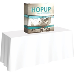 30in x 30in HopUp Straight 1x1 Tabletop Display with Full Fitted Graphic has a light weight, heavy duty frame that holds a fabric graphic mural. Durable stretch fabric graphic stays attached to the HopUp frame for fast and efficient use.