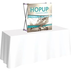 30in x 30in HopUp Straight 1x1 Tabletop Display with Front Graphic has a light weight, heavy duty frame that holds a fabric graphic mural. Durable stretch fabric graphic stays attached to the HopUp frame for fast and efficient use.