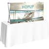 5ft Straight HopUp 2x1 Tabletop Fabric Trade Show Display with Front Graphic has a light weight, heavy duty frame that holds a fabric graphic mural. It sets up in seconds and can be packed away just as quickly after trade show or event