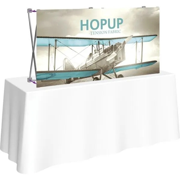 5ft Straight HopUp 2x1 Tabletop Fabric Trade Show Display with Front Graphic has a light weight, heavy duty frame that holds a fabric graphic mural. It sets up in seconds and can be packed away just as quickly after trade show or event