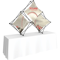 8ft Xclaim Tabletop 3 Quad Pyramid Fabric Popup Display Kit 01 with Full Fabric Graphics. Portable tabletop displays and exhibits. Several different styles are available, including pop up frames with stretch fabric or fold up panels