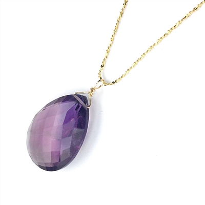 A faceted amethyst teardrop necklace on a gold vermeil sterling silver chain