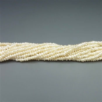 2mm button white fresh water pearls, one 16" strand