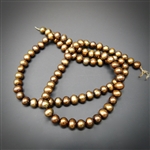 4-5mm chocolate colored round fresh water pearls, one 15 inch strand